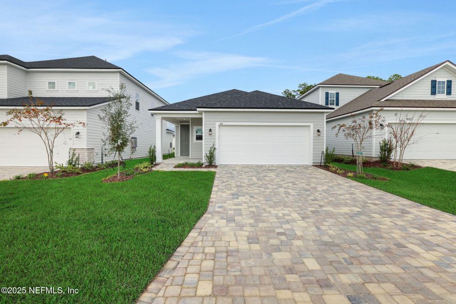 Front exterior of a new home in Brook Forest, St. Augustine, FL, highlighting curb appeal (Image 20).