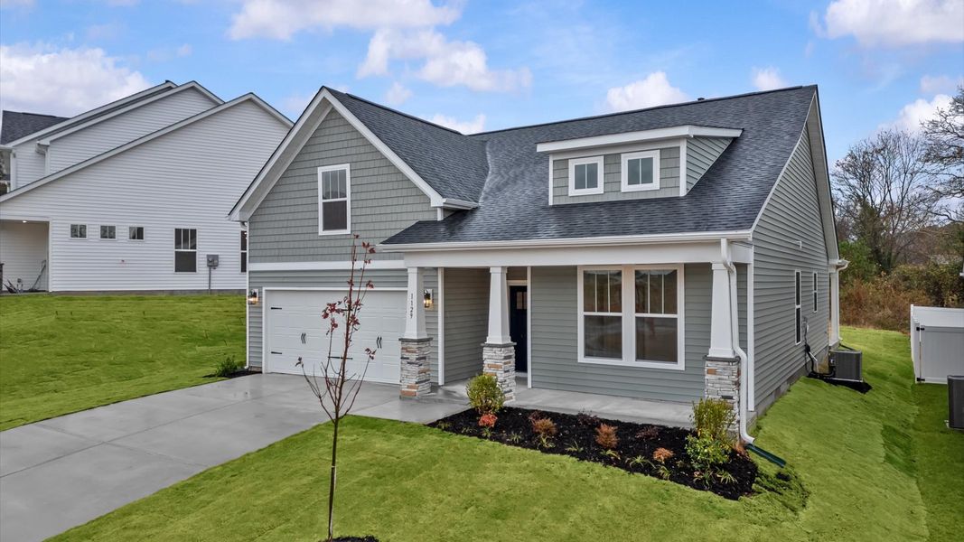 Front exterior of a new home in Iris Meadows, Moore, SC, highlighting curb appeal (Image 20).