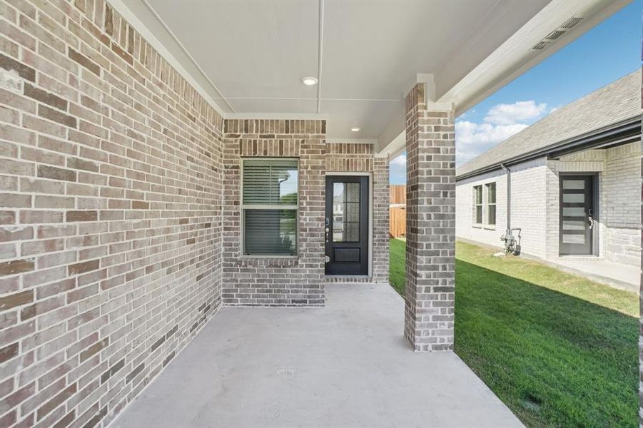 Exterior details and patio area of a home in Eastridge - Spring Series, McKinney (Image 3). Exterior details and patio area of a home in Eastridge - Spring Series, McKinney (Image 3).