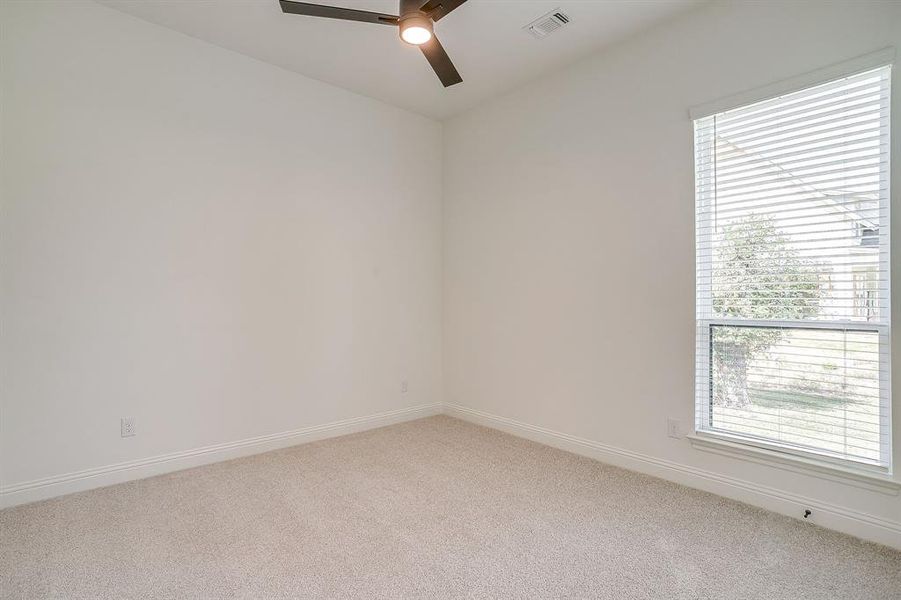 Secondary bedroom with ceiling fan. Secondary bedroom with ceiling fan.
