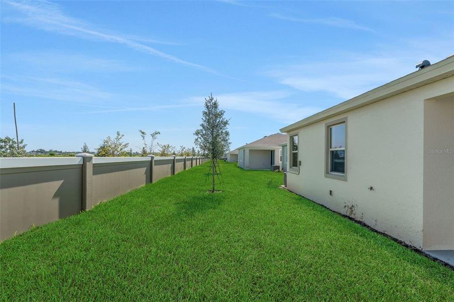 Exterior details and patio area of a home in Seaire, Parrish (Image 27).