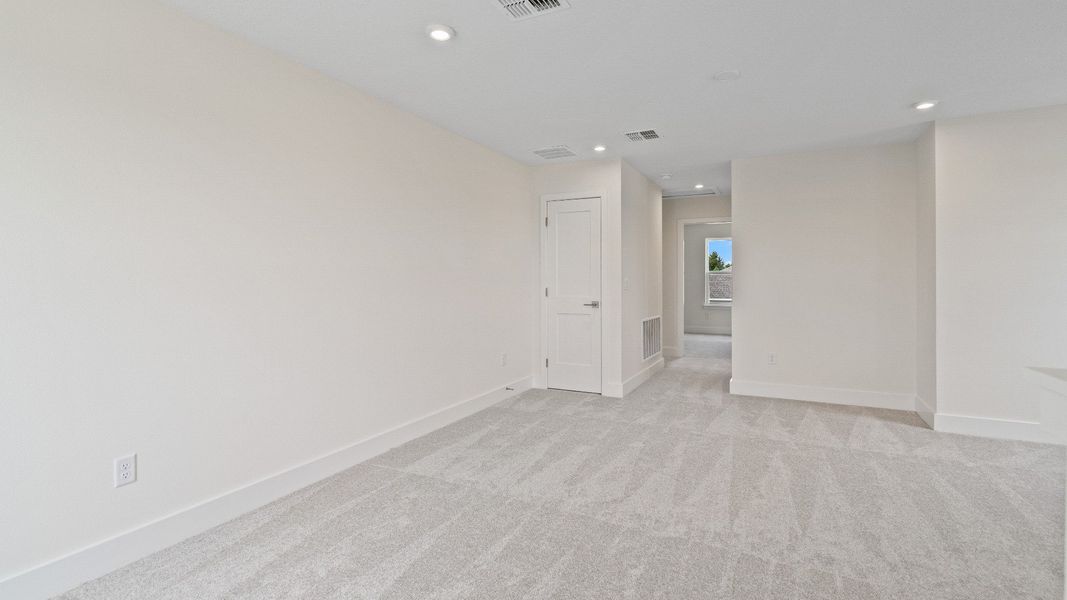 The Sweetgum Spacious and Bright second story loft area in Trailside at Mount Dora by DRB Homes