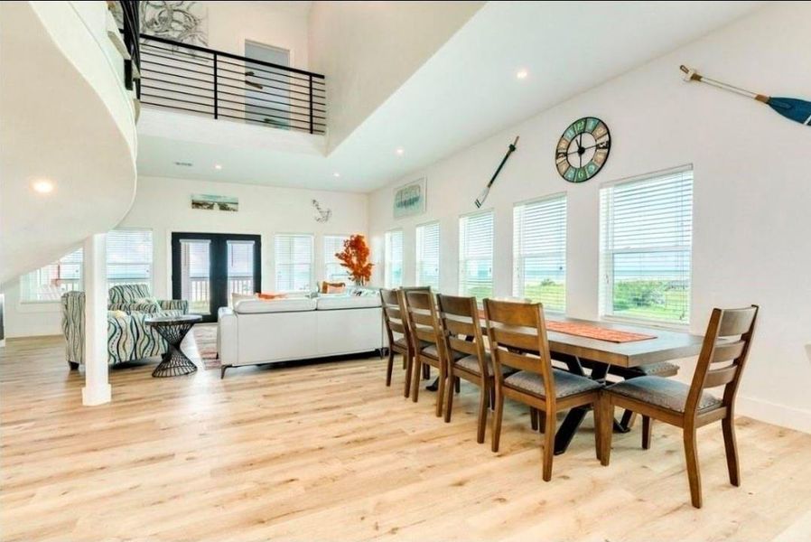 Enjoy family meals with views of the beach from the wall of windows