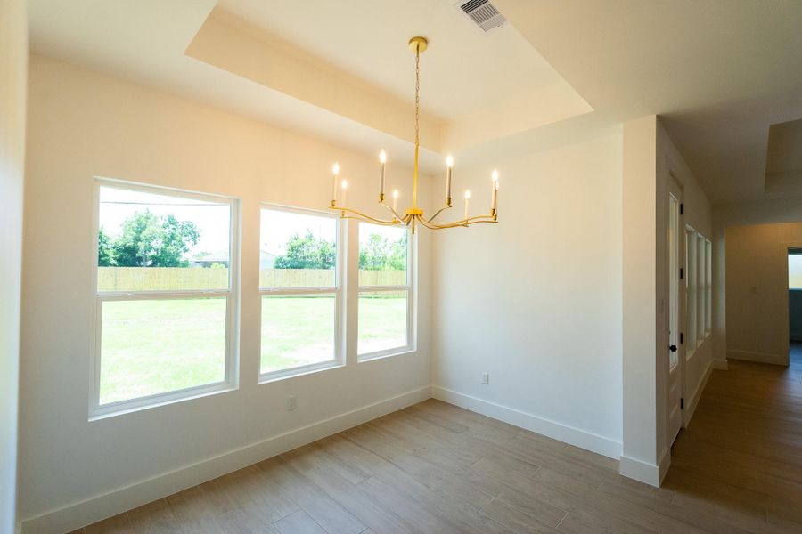 Dining room with a modern designer chandelier