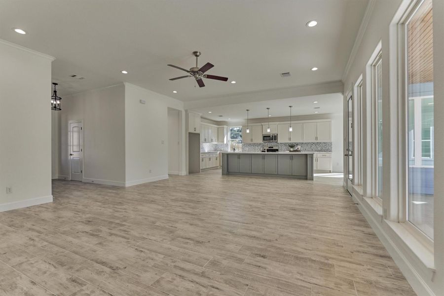 The den seamlessly blends into the kitchen, transforming this living space for optimal functionality and design. The den seamlessly blends into the kitchen, transforming this living space for optimal functionality and design.