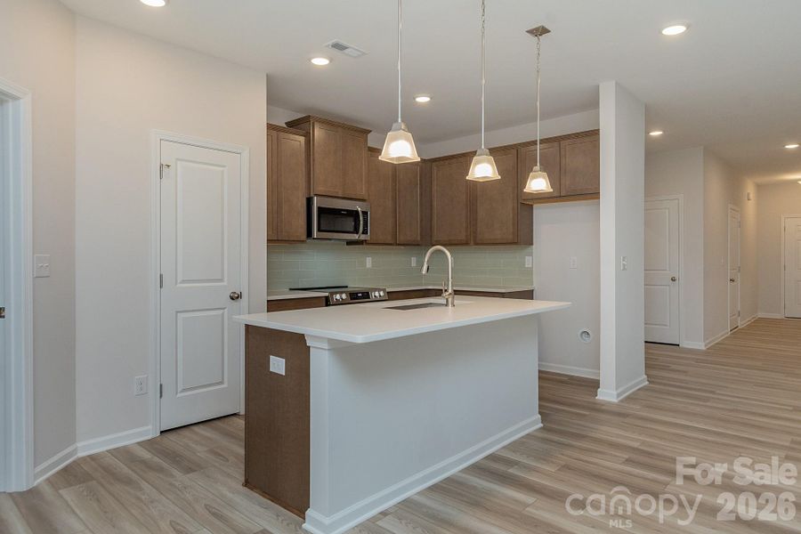 Furnished interior view inside a new home in Pine Bluff, Midland (Image 6). Furnished interior view inside a new home in Pine Bluff, Midland (Image 6).