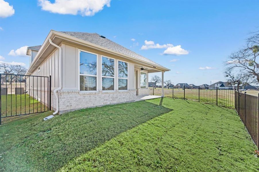 Exterior details and patio area of a home in The Resort on Eagle Mt. Lake, Fort Worth (Image 21).