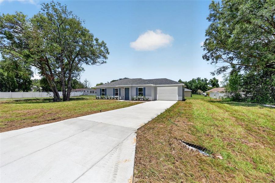 Front exterior of a new home in , Ocala, FL, highlighting curb appeal (Image 18). Front exterior of a new home in , Ocala, FL, highlighting curb appeal (Image 18).