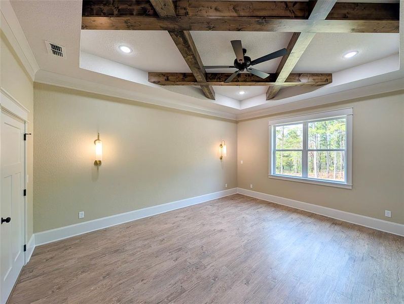 Unfurnished room with light wood finished floors, coffered ceiling, beam ceiling, a ceiling fan, and recessed lighting