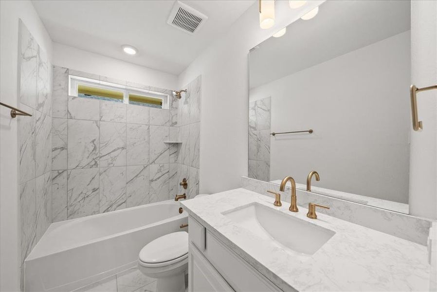 Full bath featuring shower / washtub combination and vanity Full bath featuring shower / washtub combination and vanity