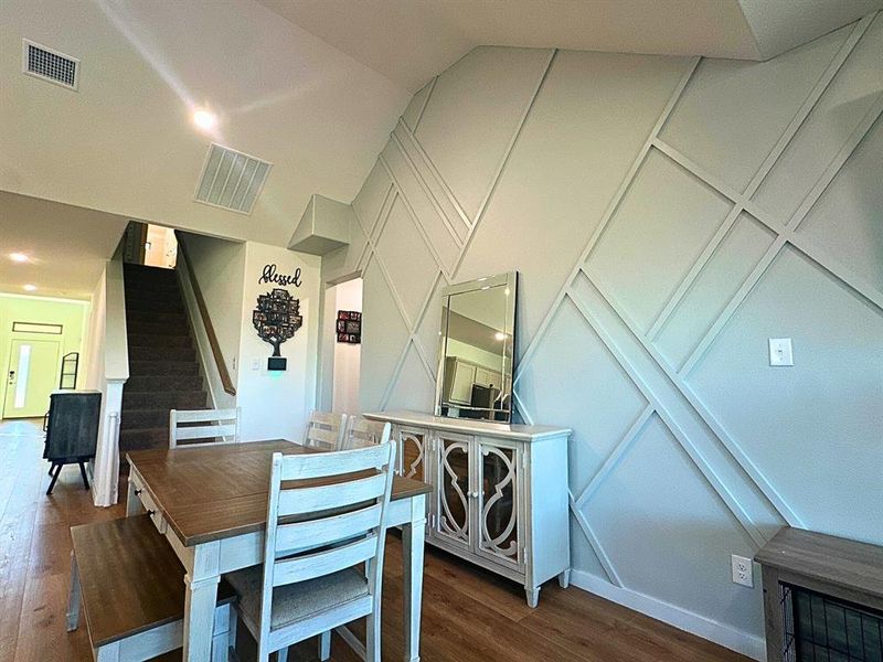 Dining area with stairs, dark wood finished floors, and recessed lighting