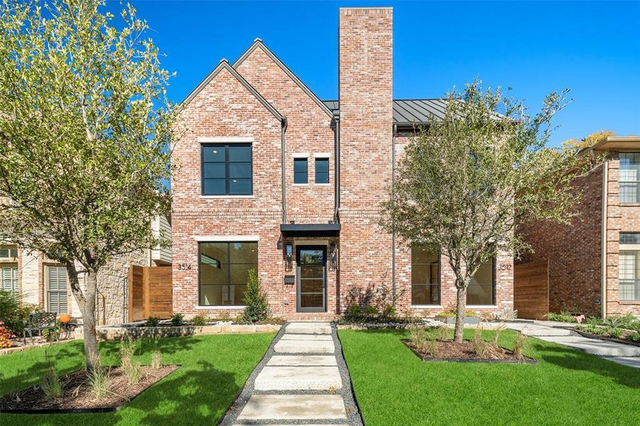 View of front of property featuring a front lawn