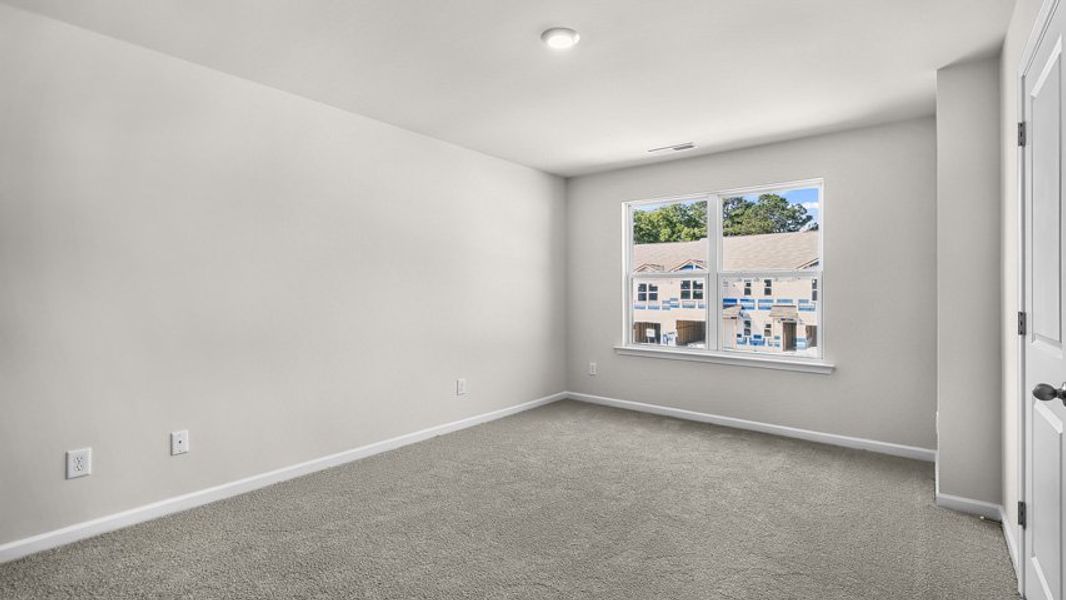 Spacious, unfurnished interior of a new home in Edinborough Townes, Gibsonville (Image 12).