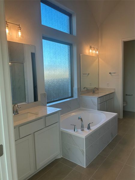 Primary Bath retreat with dual vanities & garden tub