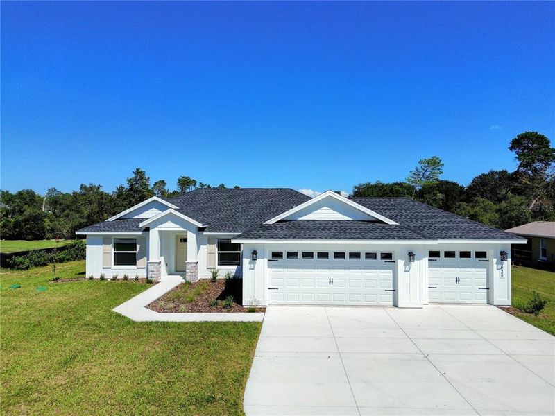 Front exterior of a new home in , Ocala, FL, highlighting curb appeal (Image 2).