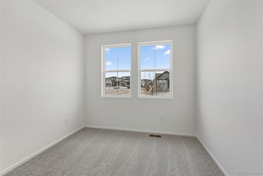 Spacious, unfurnished interior of a new home in The Cottages Collection at Ridgeline Vista, Brighton (Image 10).