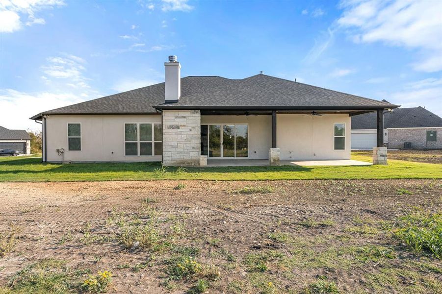 Rear view of property with a patio area with double sliding doors