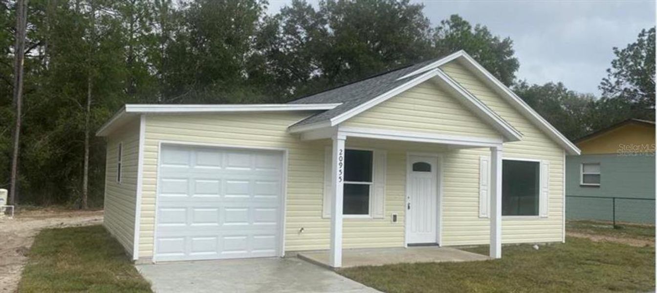Front exterior of a new home in , Ocala, FL, highlighting curb appeal (Image 1). Front exterior of a new home in , Ocala, FL, highlighting curb appeal (Image 1).