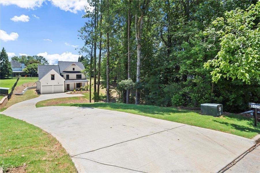 Front exterior of a new home in , Cumming, GA, highlighting curb appeal (Image 2). Front exterior of a new home in , Cumming, GA, highlighting curb appeal (Image 2).