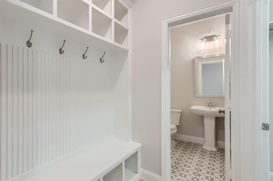 Mudroom with sink and tile patterned floors