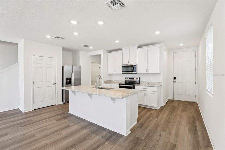 Furnished interior view inside a new home in The Meadow at Crossprairie Townes, St. Cloud (Image 8).