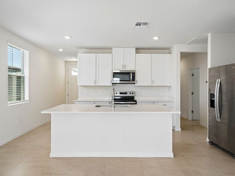 Furnished interior view inside a new home in Two Rivers - Premier Series, Zephyrhills (Image 4).