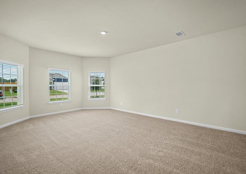 The master bedroom has beautiful bay windows.