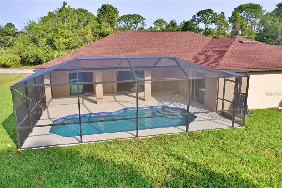 Exterior details and patio area of a home in , North Port (Image 29).