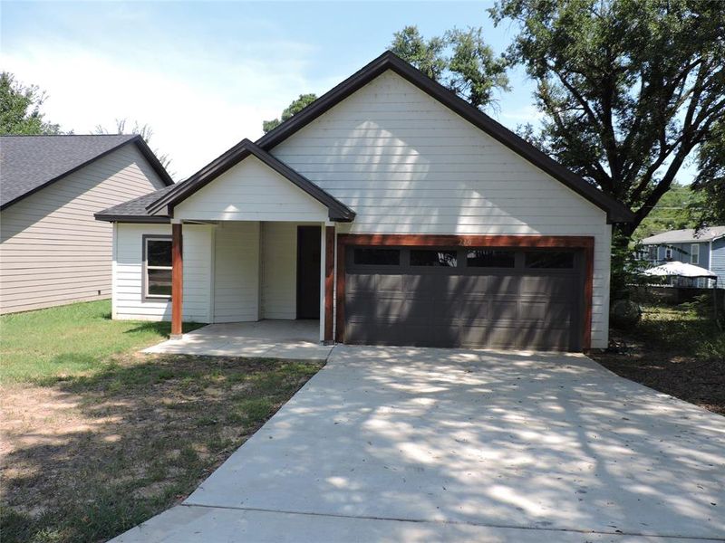 Front exterior of a new home in , Gun Barrel City, TX, highlighting curb appeal (Image 2). Front exterior of a new home in , Gun Barrel City, TX, highlighting curb appeal (Image 2).