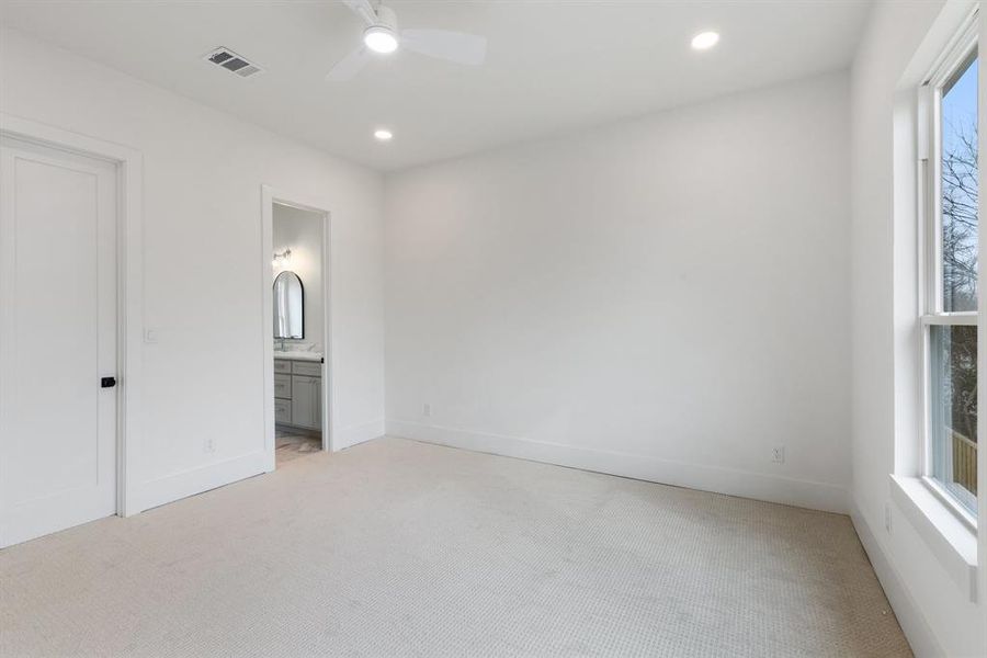 One of the two bedrooms at the rear that share a Jack and Jill bath.