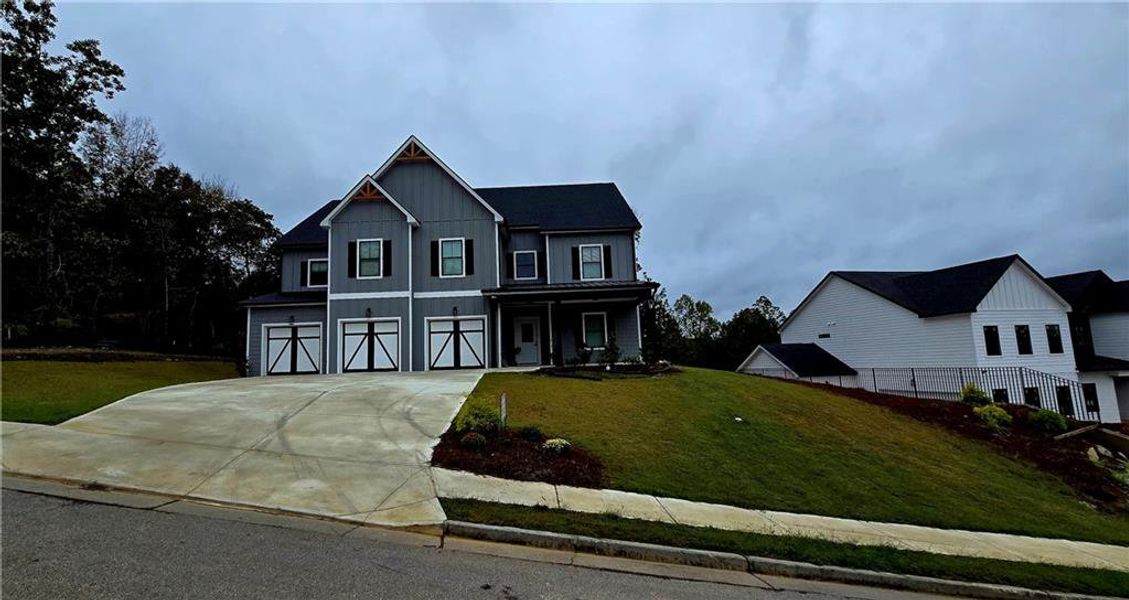 Front exterior of a new home in Silvercrest Lakes, Acworth, GA, highlighting curb appeal (Image 28).
