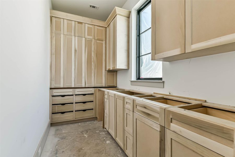 This is the progress photo for the scullery kitchen from May 26th. Note we added upper cabinets in place of the open shelving in the rendering. The sink and second dishwasher should be installed shortly.