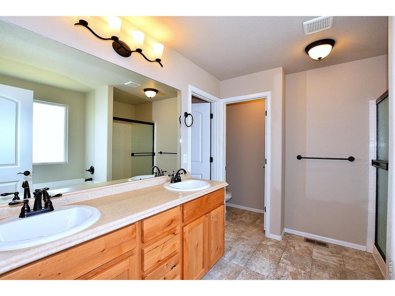 Furnished interior view inside a new home in Union Colony West, Greeley (Image 15).