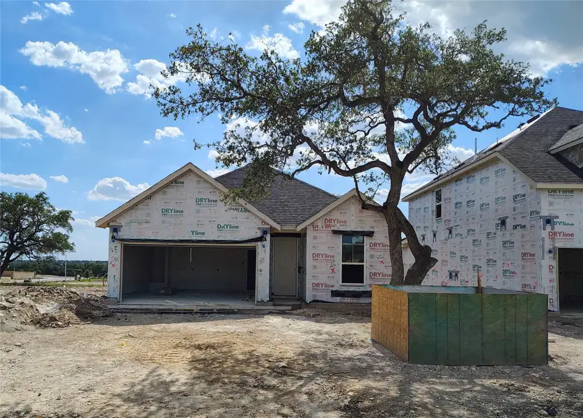 Front exterior of a new home in Woodside, Georgetown, TX, highlighting curb appeal (Image 1). Front exterior of a new home in Woodside, Georgetown, TX, highlighting curb appeal (Image 1).