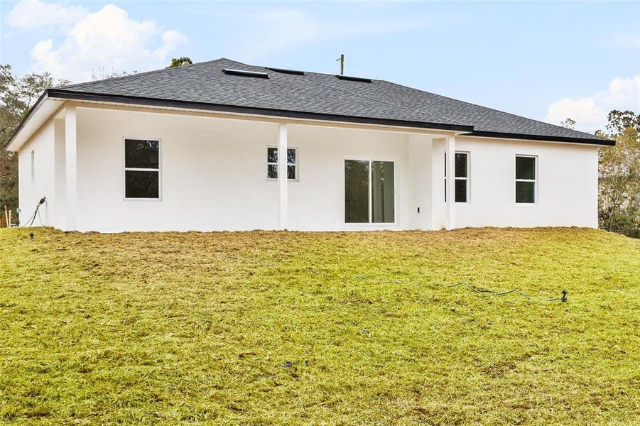 Front exterior of a new home in , Citrus Springs, FL, highlighting curb appeal (Image 1).
