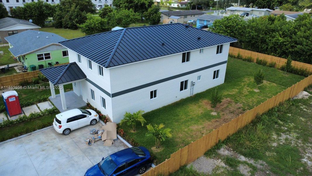 Front exterior of a new home in , Florida City, FL, highlighting curb appeal (Image 24). Front exterior of a new home in , Florida City, FL, highlighting curb appeal (Image 24).
