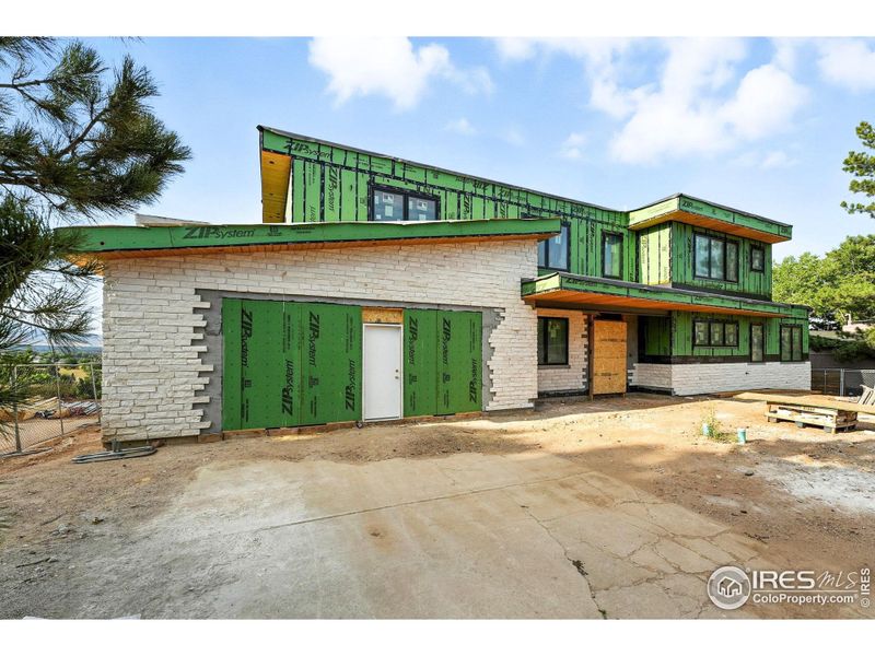 Oversized 3 car garage, comfortably accommodates three cars plus space for gear and recreational toys