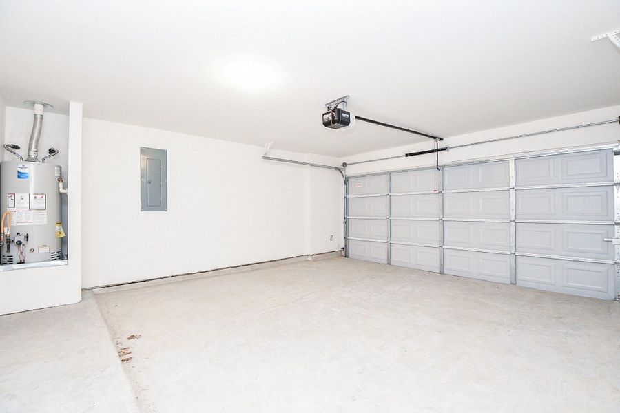 Two-car garage with ample storage space as needed.