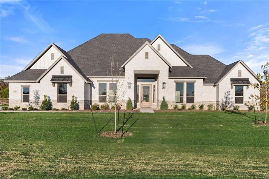 View of front of property with a front lawn