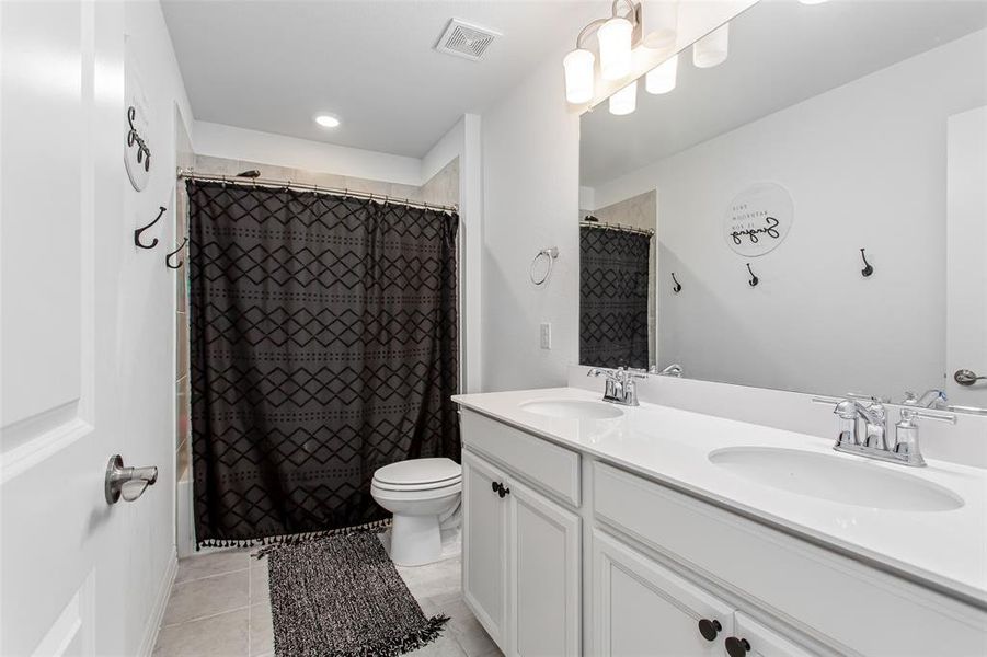 View of oversized 
fenced backyard