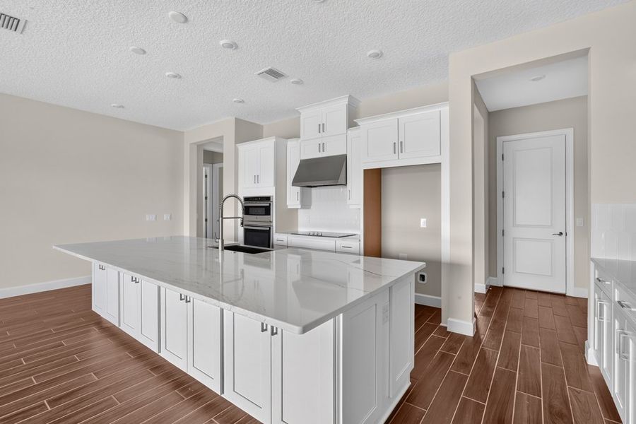 Furnished interior view inside a new home in Westview Community Group Page, Kissimmee (Image 4).