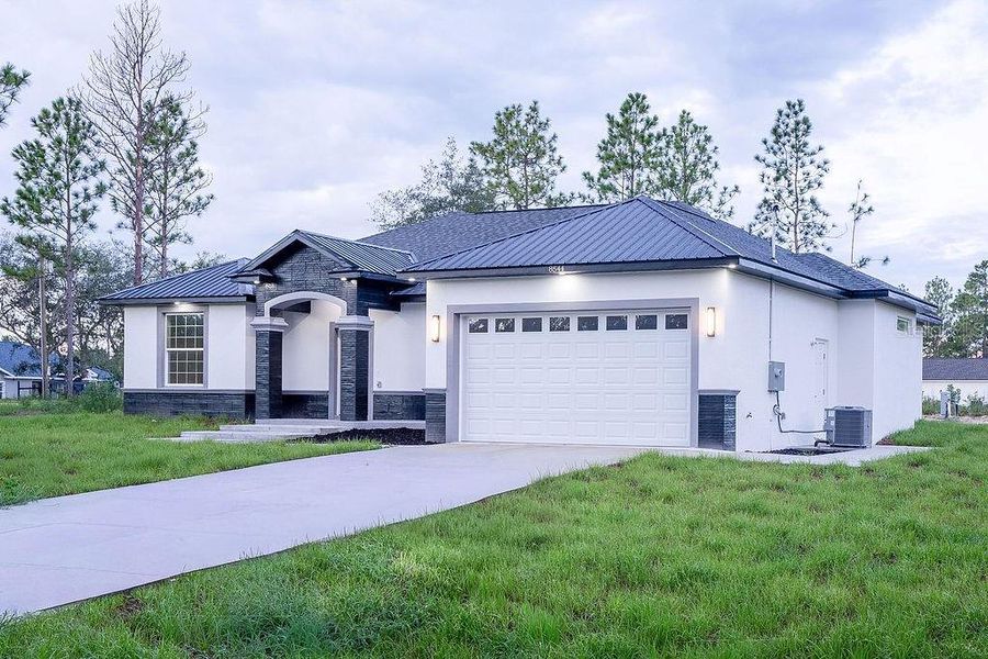 Front exterior of a new home in , Dunnellon, FL, highlighting curb appeal (Image 32). Front exterior of a new home in , Dunnellon, FL, highlighting curb appeal (Image 32).
