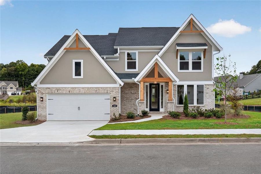 Front exterior of a new home in Hidden Fields, Hoschton, GA, highlighting curb appeal (Image 20). Front exterior of a new home in Hidden Fields, Hoschton, GA, highlighting curb appeal (Image 20).