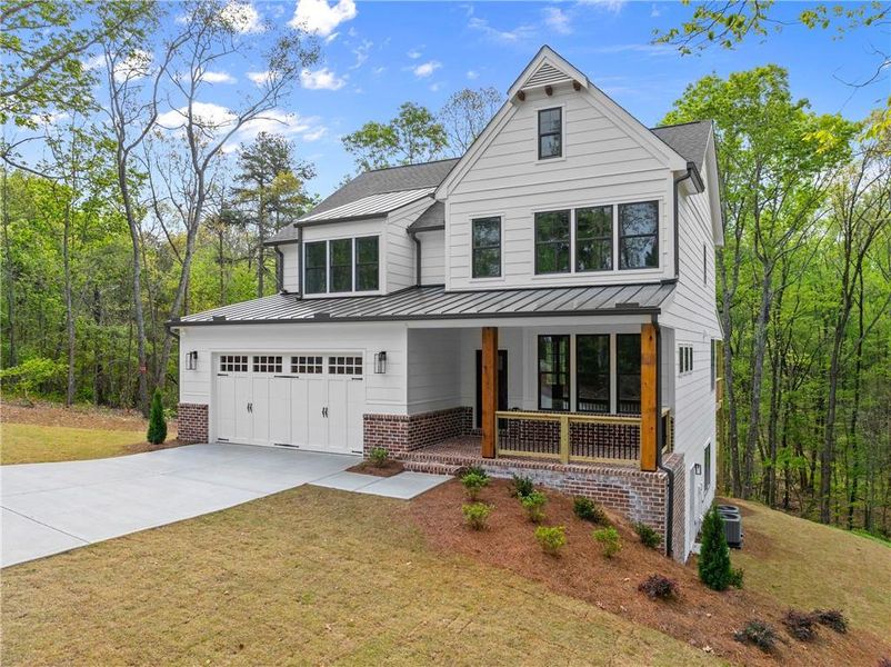 Front exterior of a new home in , Dawsonville, GA, highlighting curb appeal (Image 1). Front exterior of a new home in , Dawsonville, GA, highlighting curb appeal (Image 1).