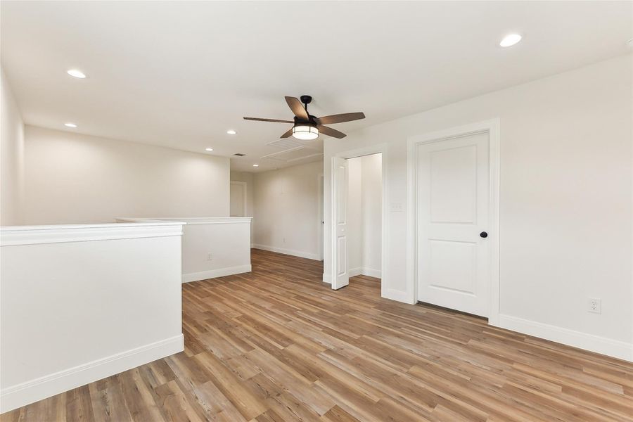 Upstairs Family Area featuring baseboards, recessed lighting, light wood-style floors, and ceiling fan Upstairs Family Area featuring baseboards, recessed lighting, light wood-style floors, and ceiling fan