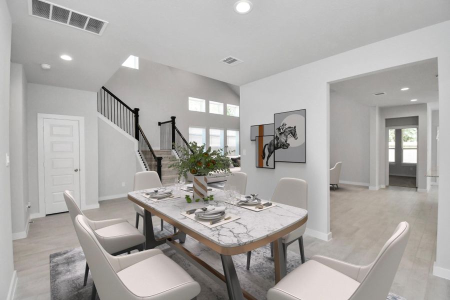 Virtually Staged - Dining Room. Sample photo of completed home with similar floor plan. Actual colors and selections may vary.