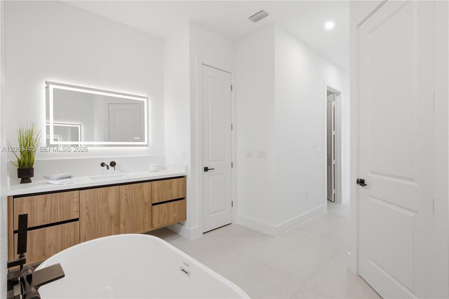 Designer tile, sleek fixtures and contemporary finishes create a luxurious private retreat. Designer tile, sleek fixtures and contemporary finishes create a luxurious private retreat.