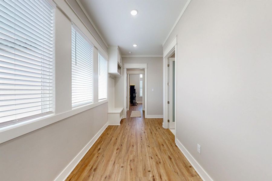 the office is located at the end of the hallway just past the garage door and mud room. Turn right to another bedroom and the half bath.