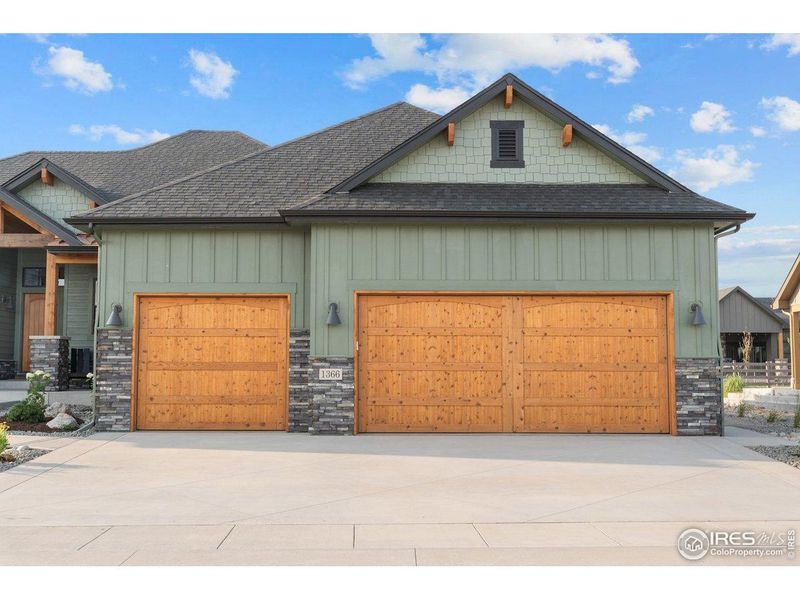 Front exterior of a new home in Harvest Ridge, Berthoud, CO, highlighting curb appeal (Image 23).