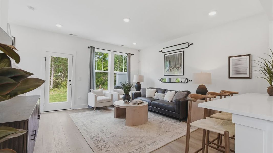 Hardwood flooring and high standards define this vibrant family room ideal for everyday living at the Churchill Design